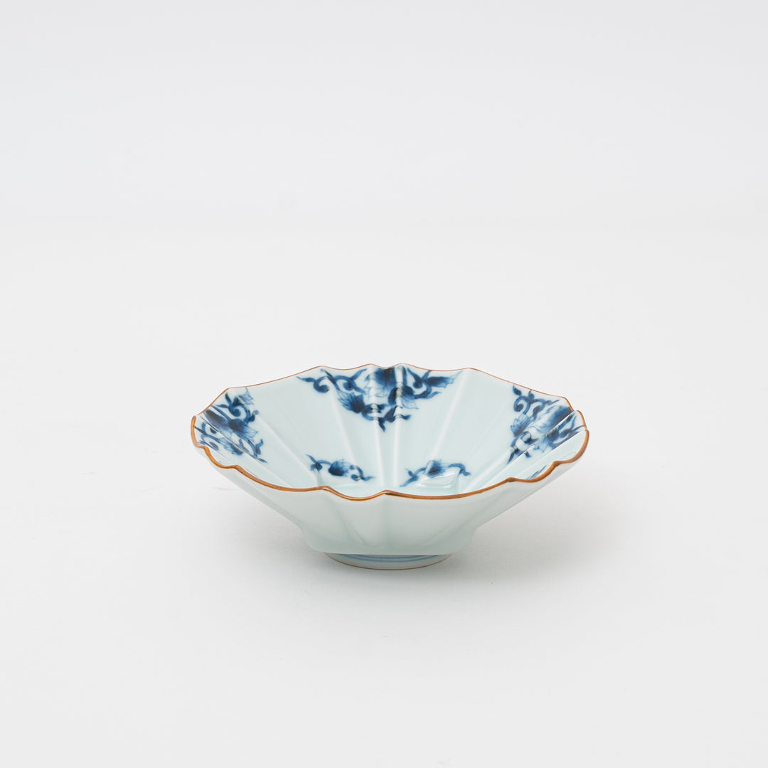 Japanese Arita Ware Kiriko faceted bowl with hand-dyed blue arabesque patterns, approx 14cm diameter