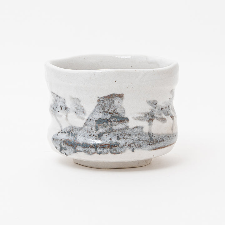 Handmade Mino Ware ceramic matcha bowl with a white and gray glaze, crafted in Japan. Close-up of the textured surface and unique shape