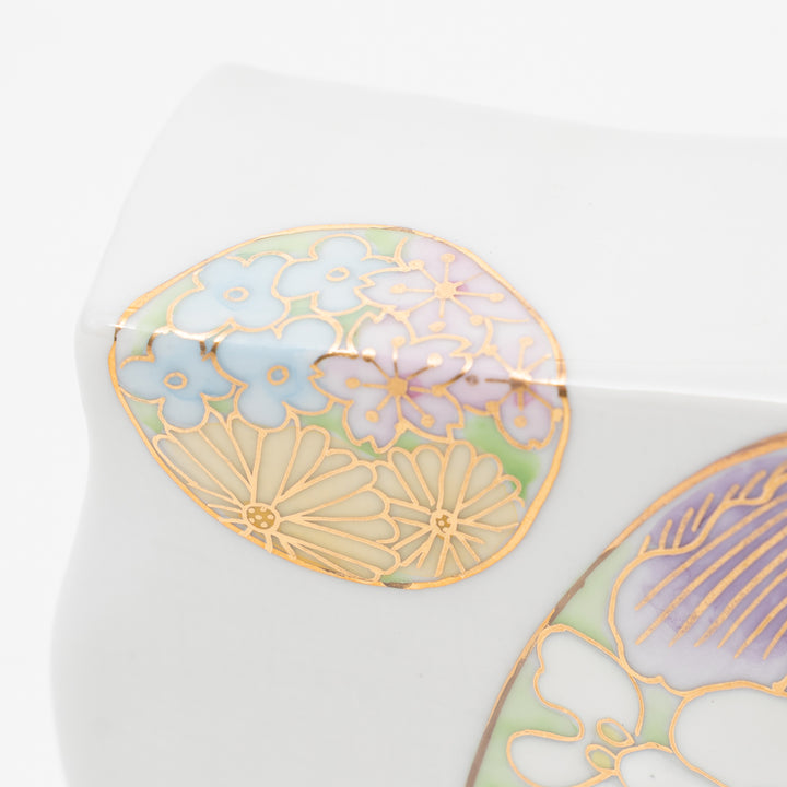 Detailed shot of the gold-gilded floral design on a Kutani Ware vase.