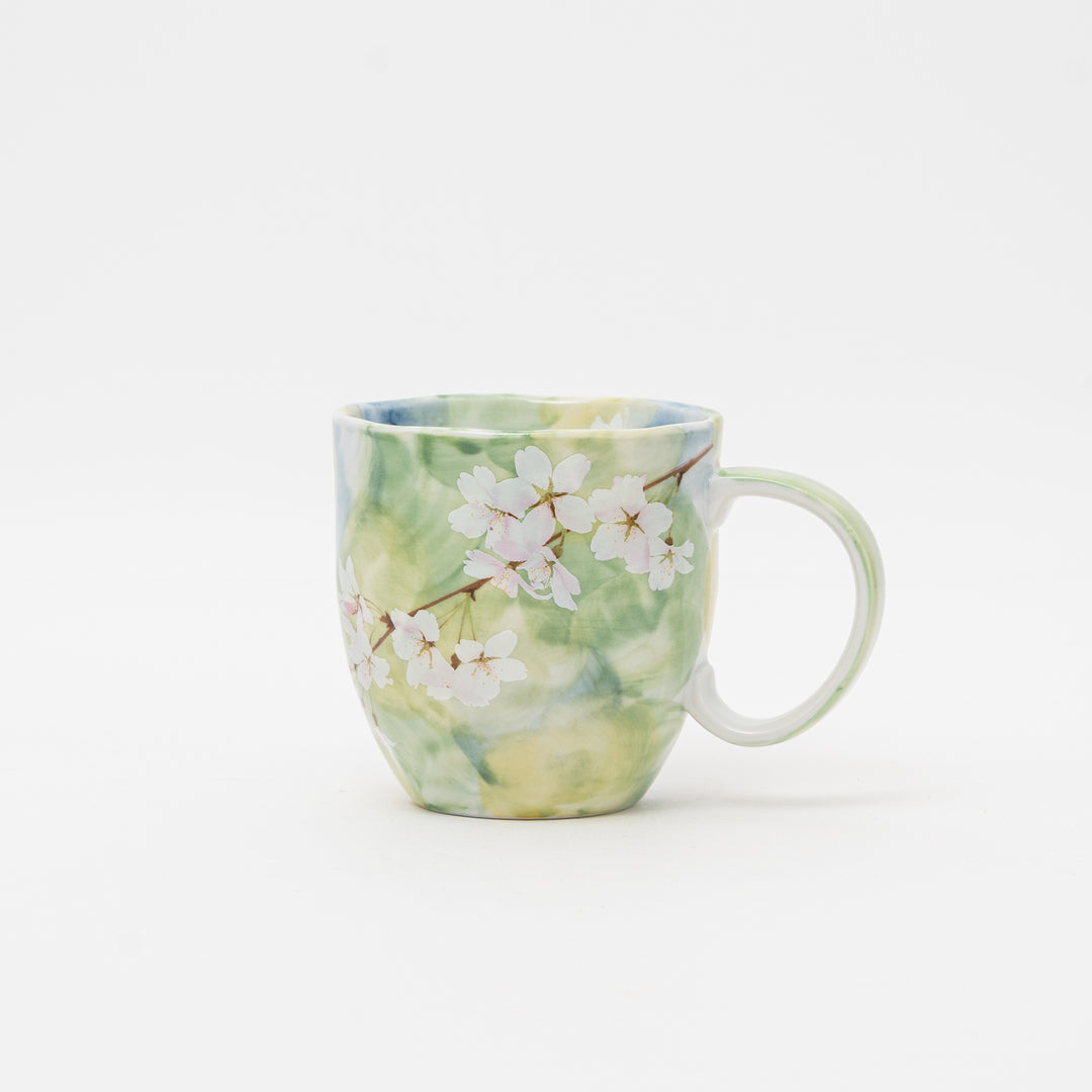 A full view of the 340ml Japanese porcelain mug with an elegant cherry blossom design on a clean white background.