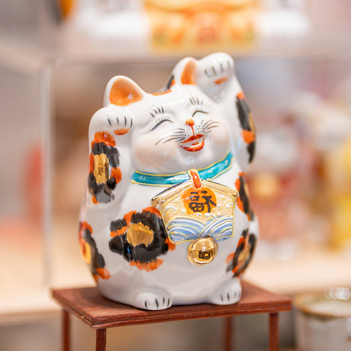 Decorative cat figurine with a blurred background