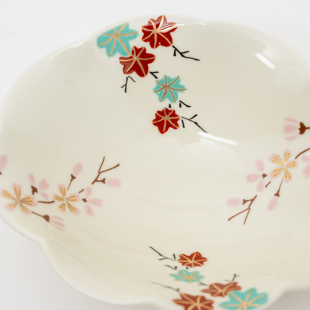 Close-up of a handmade Arita Ware bowl showing the unique floral patterns and porcelain material.