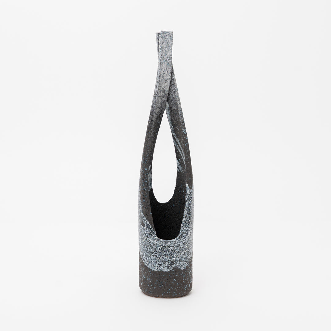 Black and gray textured vase on a white background