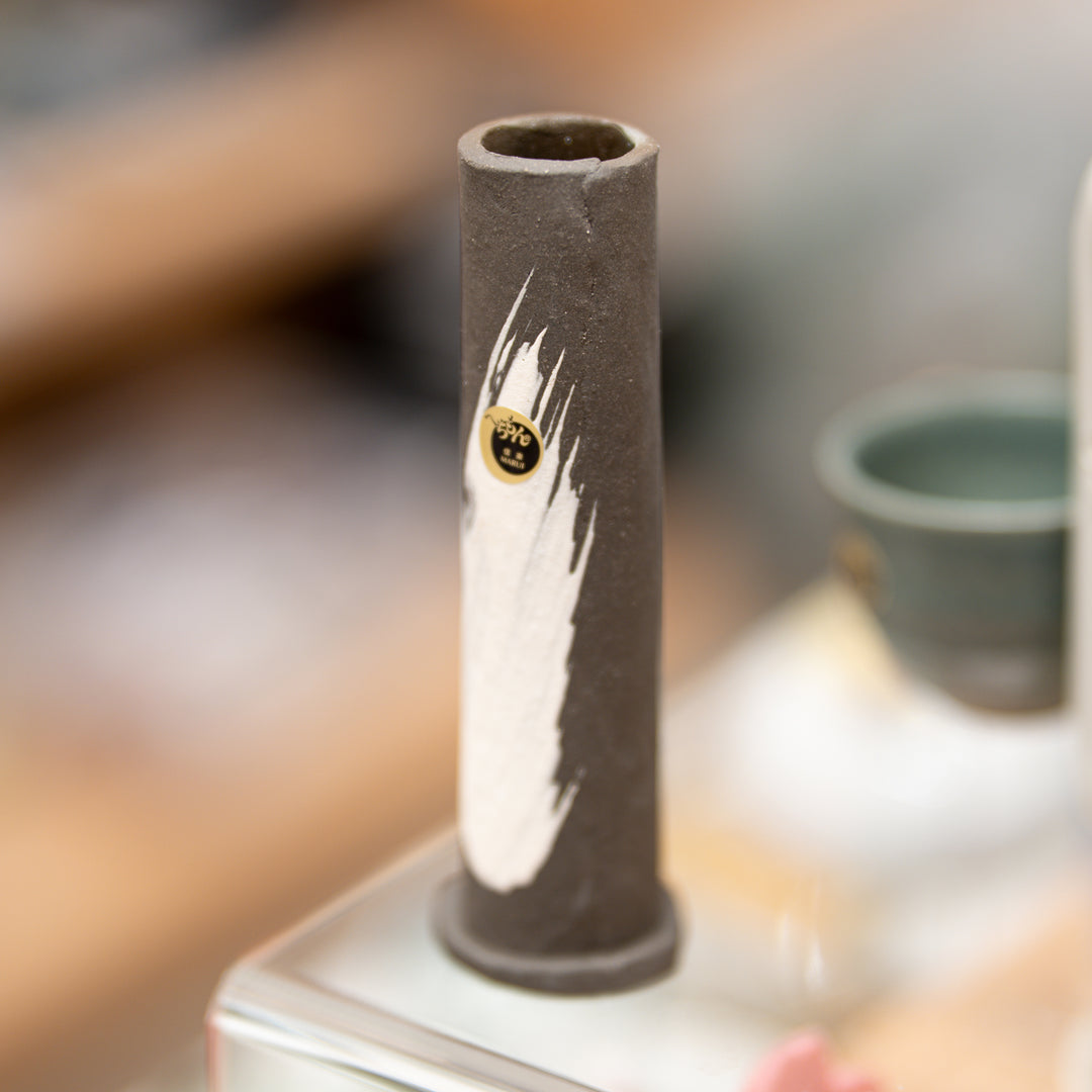 Close-up of white glaze brush stroke detail on Shigaraki pottery vase surface