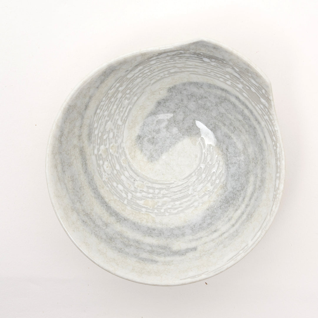 Close-up of ergonomic handle on Japanese Hakusetsu porcelain bowl showing fine craftsmanship detail