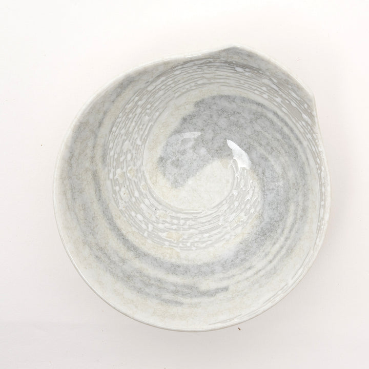 Close-up of ergonomic handle on Japanese Hakusetsu porcelain bowl showing fine craftsmanship detail