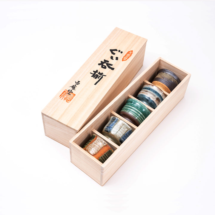 Handmade Japanese sake cup set with 5 Mino ware guinomi in
 wooden box