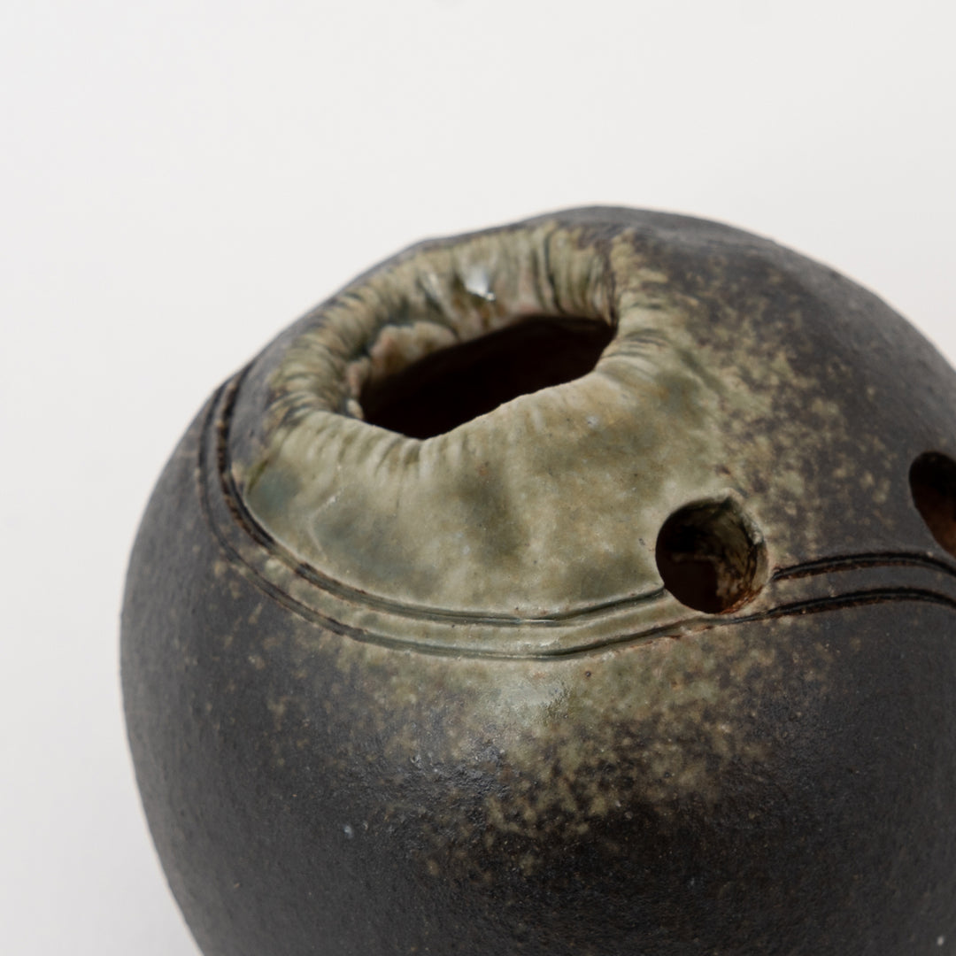 Curved incised line detail on charcoal Shigaraki Japanese pottery vase