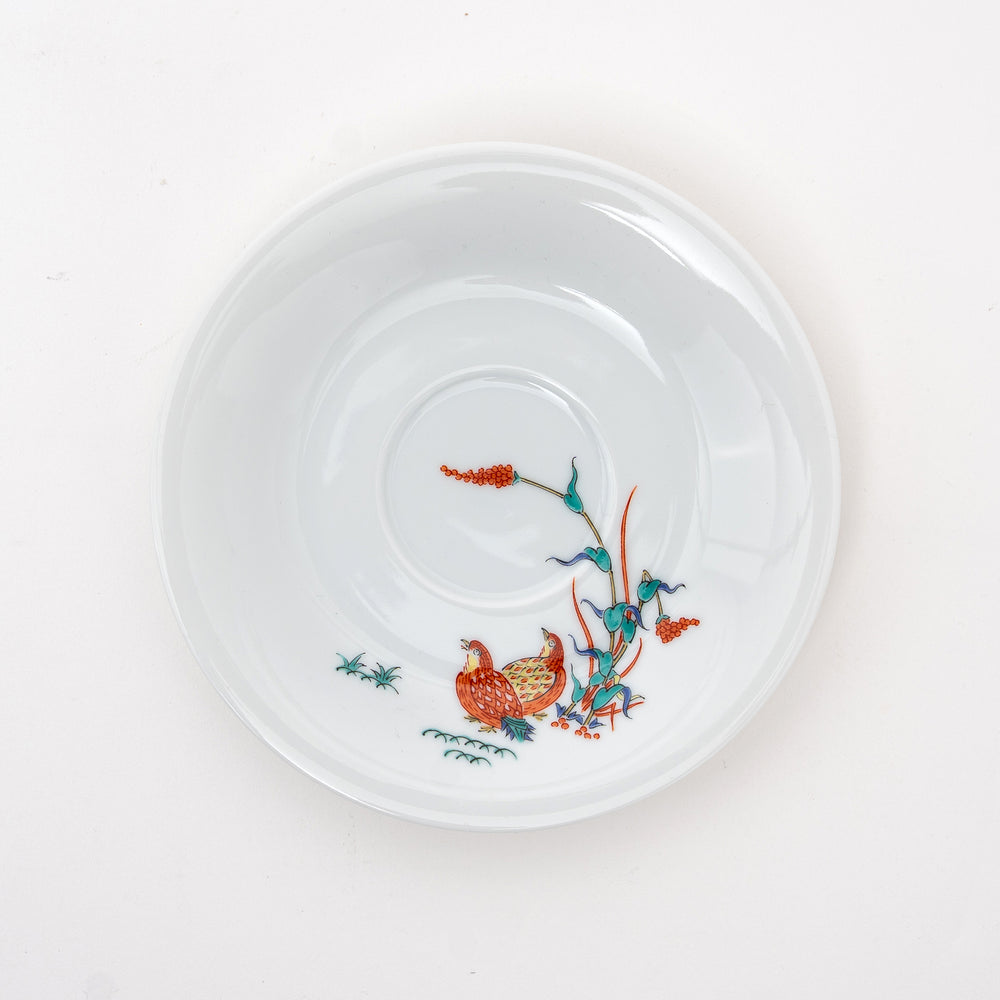 Arita Ware cup and saucer set from Japan, highlighting the colorful hand-painted quails and lush foliage


