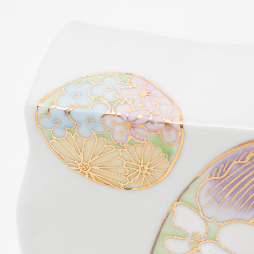 Detailed shot of the gold-gilded floral design on a Kutani Ware vase.