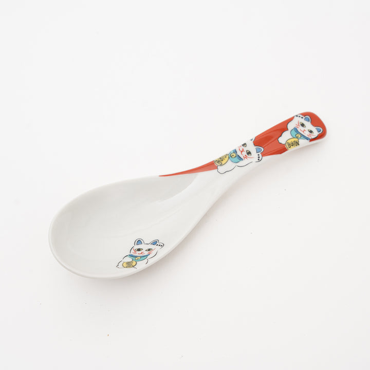 Kutani Ware Maneki-Neko ceramic spoon with a white base, red and white handle featuring two lucky cat illustrations, and a third lucky cat decorated on the spoon bowl.