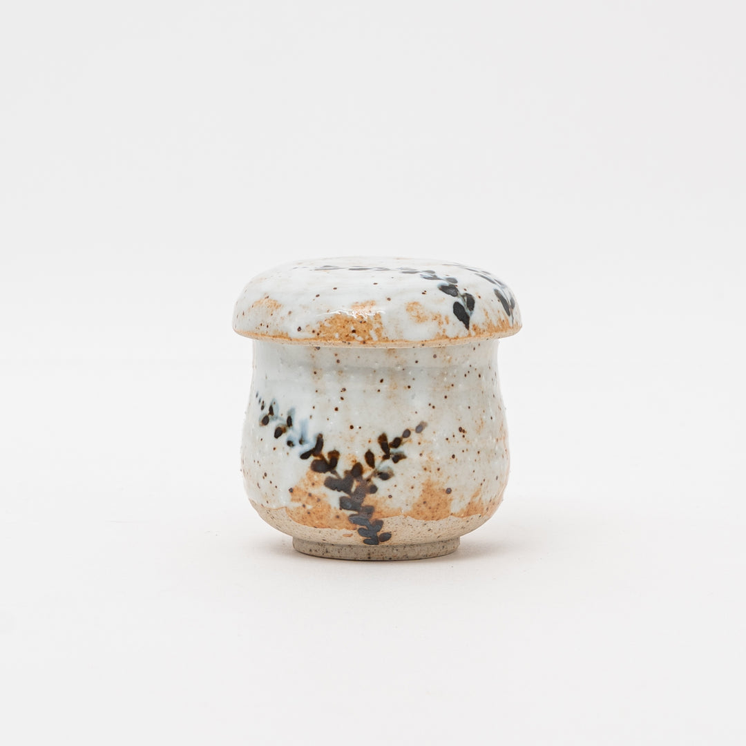 Shino Tataki Ashimushi handmade Japanese ceramic Chawanmushi bowl with a rustic hammered texture and authentic Shino glaze, viewed from the side