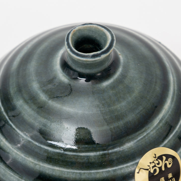 Close-up of the opening and dark teal bronze glaze texture on Shigaraki ceramic mini vase