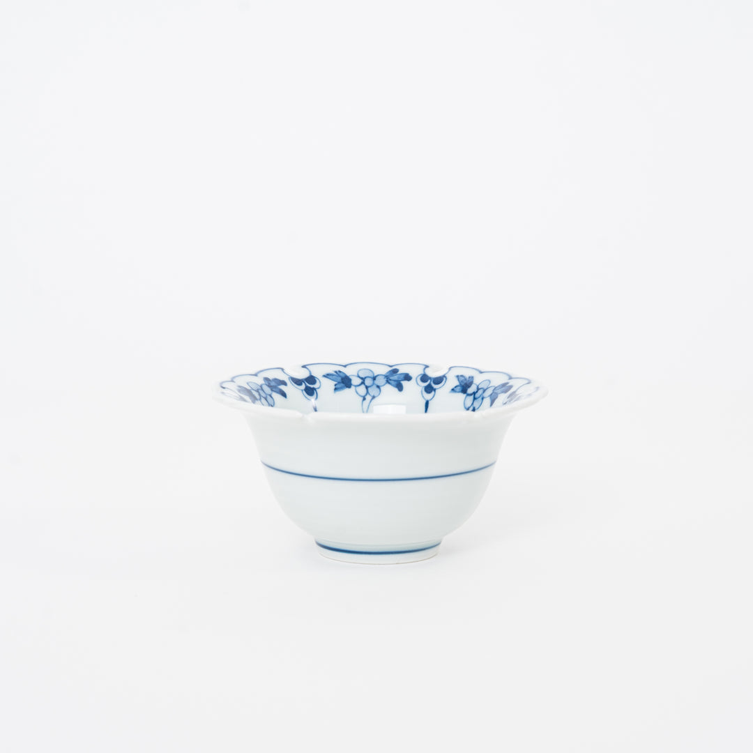 Side profile of a 3.75 inch Japanese porcelain mini bowl showing the elegant tapered shape and blue striped base design.