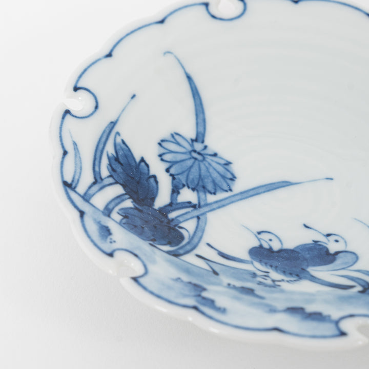 Close-up of hand-painted blue and white floral design on Japanese Hasami ware appetizer dish