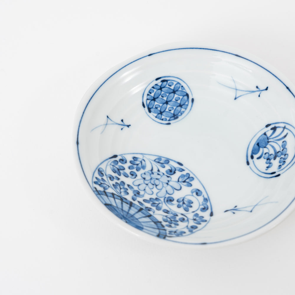 Stacked Japanese Hasami-yaki blue and white medallion plates, lightweight 80g porcelain for high-end NYC sushi bars and Long Island hospitality supply.