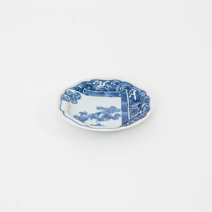 Authentic Hasami Ware blue and white scalloped Mamezara with hand-painted landscape and wave motif.