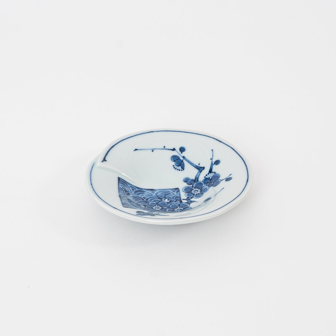 Top view of Hasami ware plum blossom small plate 11cm blue and white Japanese porcelain.
