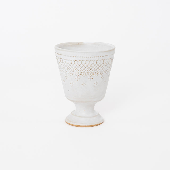 Handcrafted Japanese Mashiko-yaki ceramic footed cup in matte cream white with embossed lattice pattern
