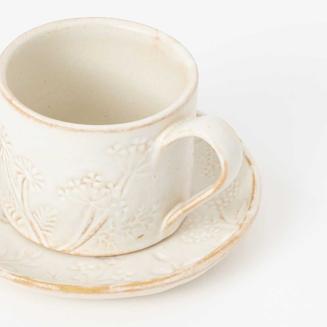 Japanese stoneware mug with embossed floral pattern for coffee and soup