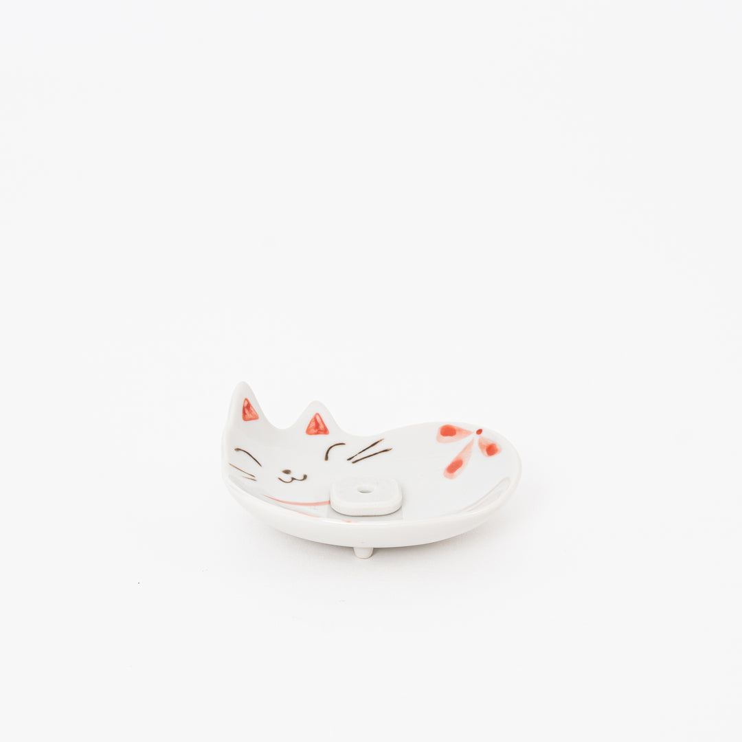 Ceramic cat-shaped dish on a white background