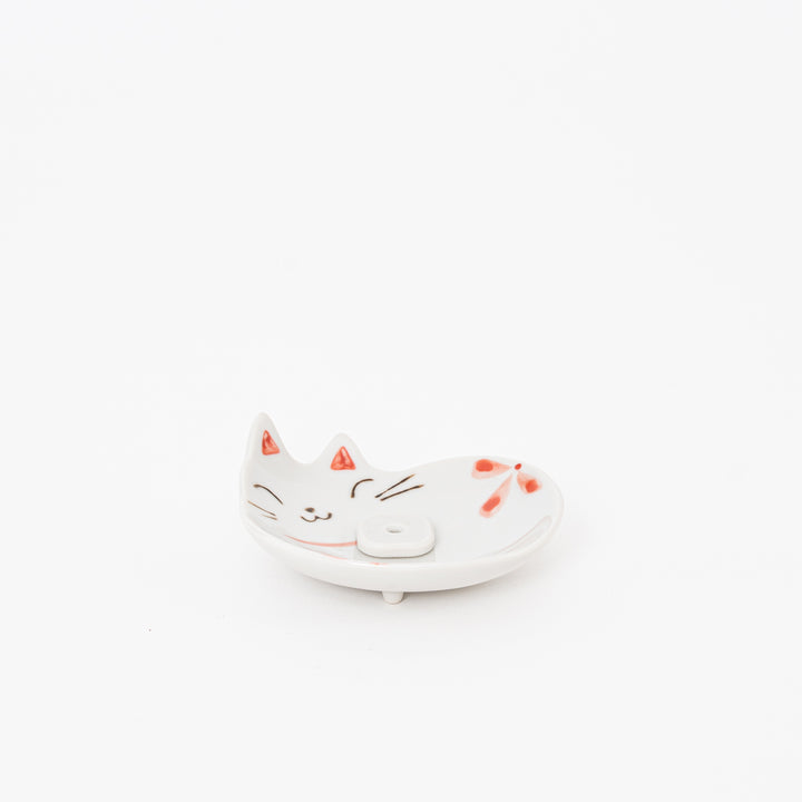 Ceramic cat-shaped dish on a white background