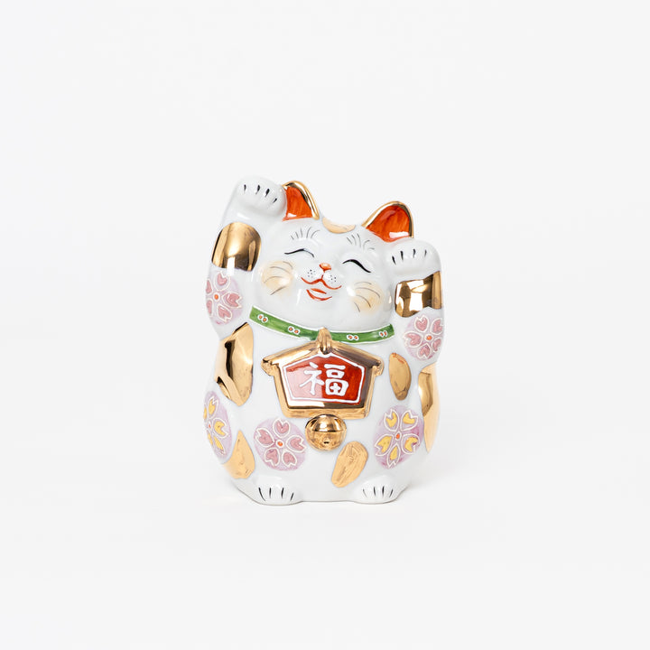 Hand-painted Kutani Yaki Maneki Neko lucky cat with both paws raised and gold accents.