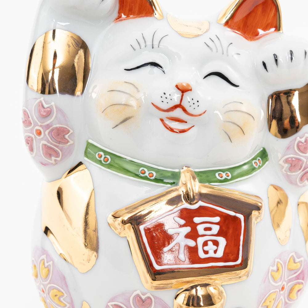 Detailed view of the Japanese kanji "Fuku" (Good Fortune) on a gold-rimmed tablet.