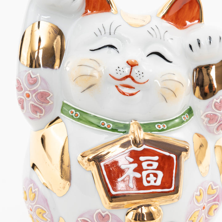 Detailed view of the Japanese kanji "Fuku" (Good Fortune) on a gold-rimmed tablet.