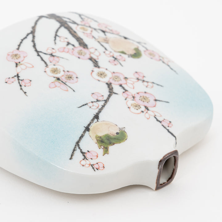 Sculptural Kutani vase featuring plum blossom and bush warbler motif