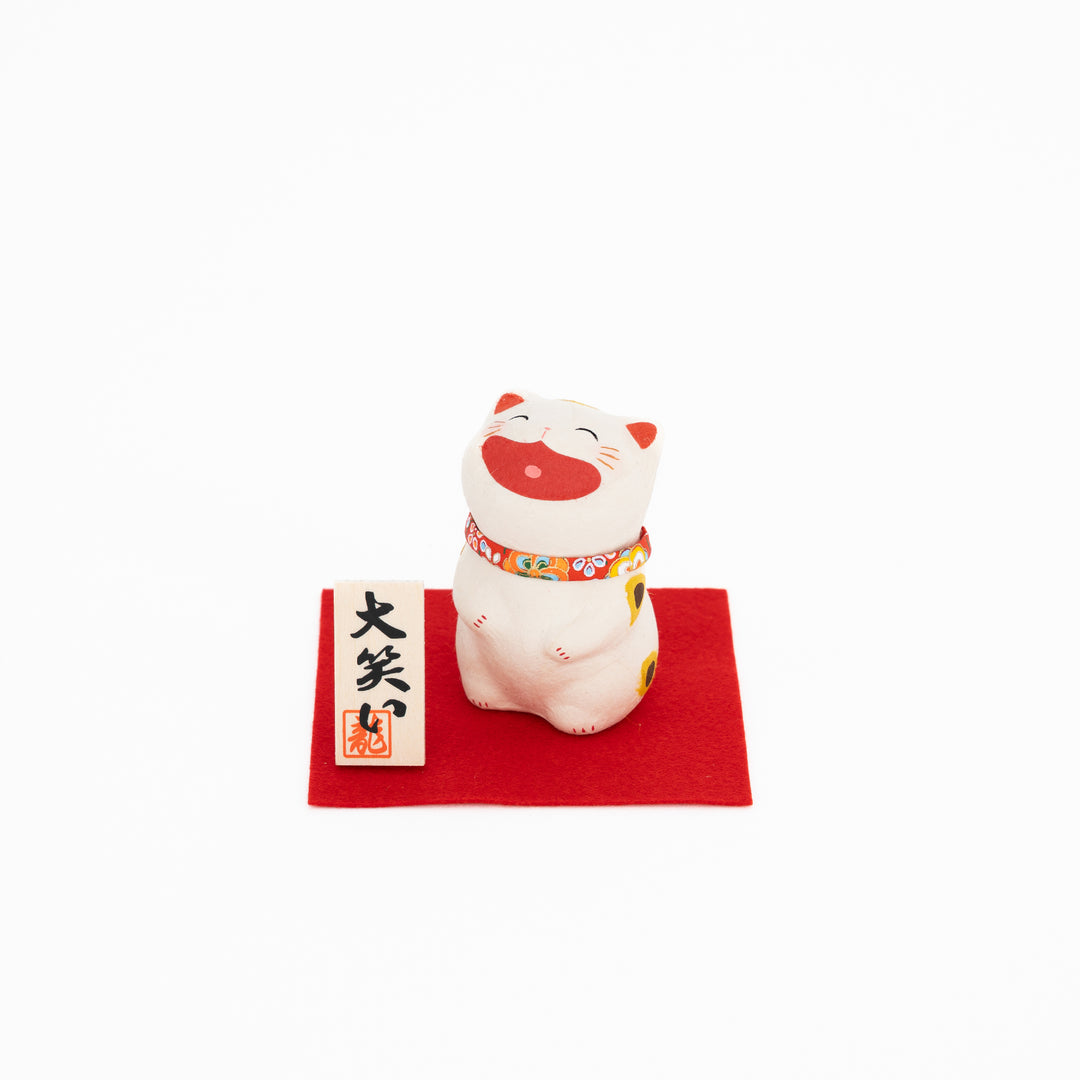 Japanese laughing buchi cat ornament on red base handmade lucky cat figurine