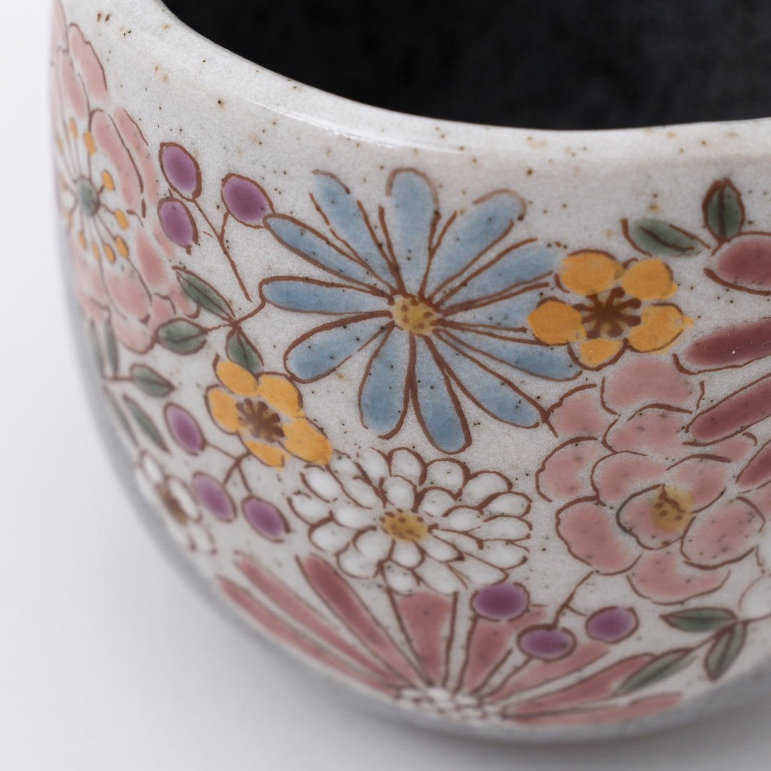 Close-up of intricate hand-painted pink flowers with gold accents on Kutani Ware mug