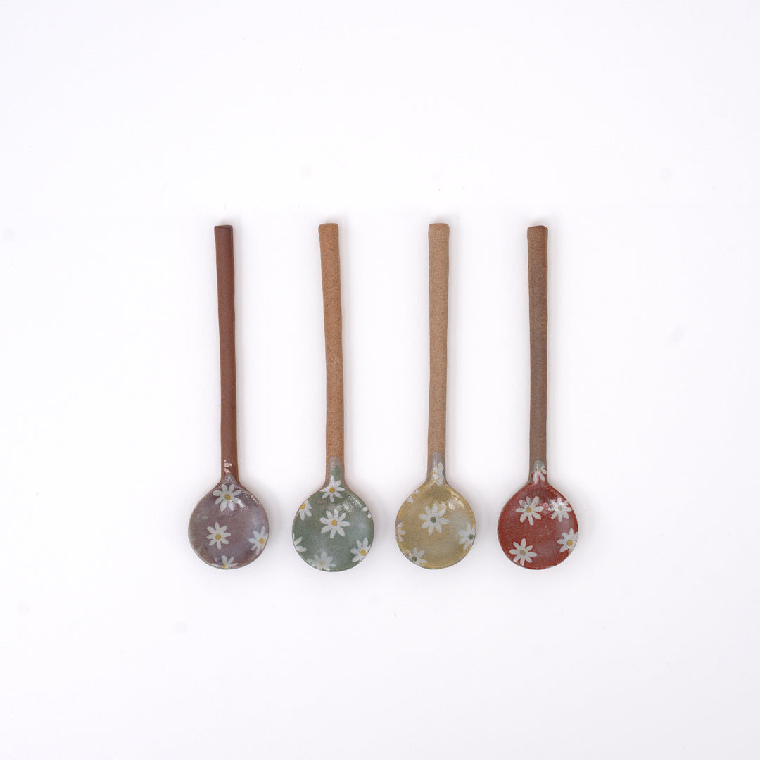 Handmade Japanese ceramic spoon with white daisy flower design