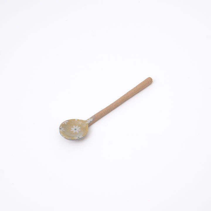 Yellow handmade Japanese ceramic spoon with daisy flowers