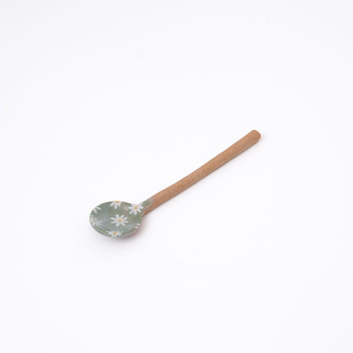 Green handmade Japanese ceramic spoon with daisy flowers