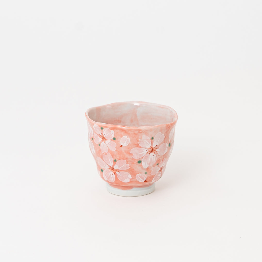 Mino Ware handmade cherry blossom tea cup with soft pink glaze