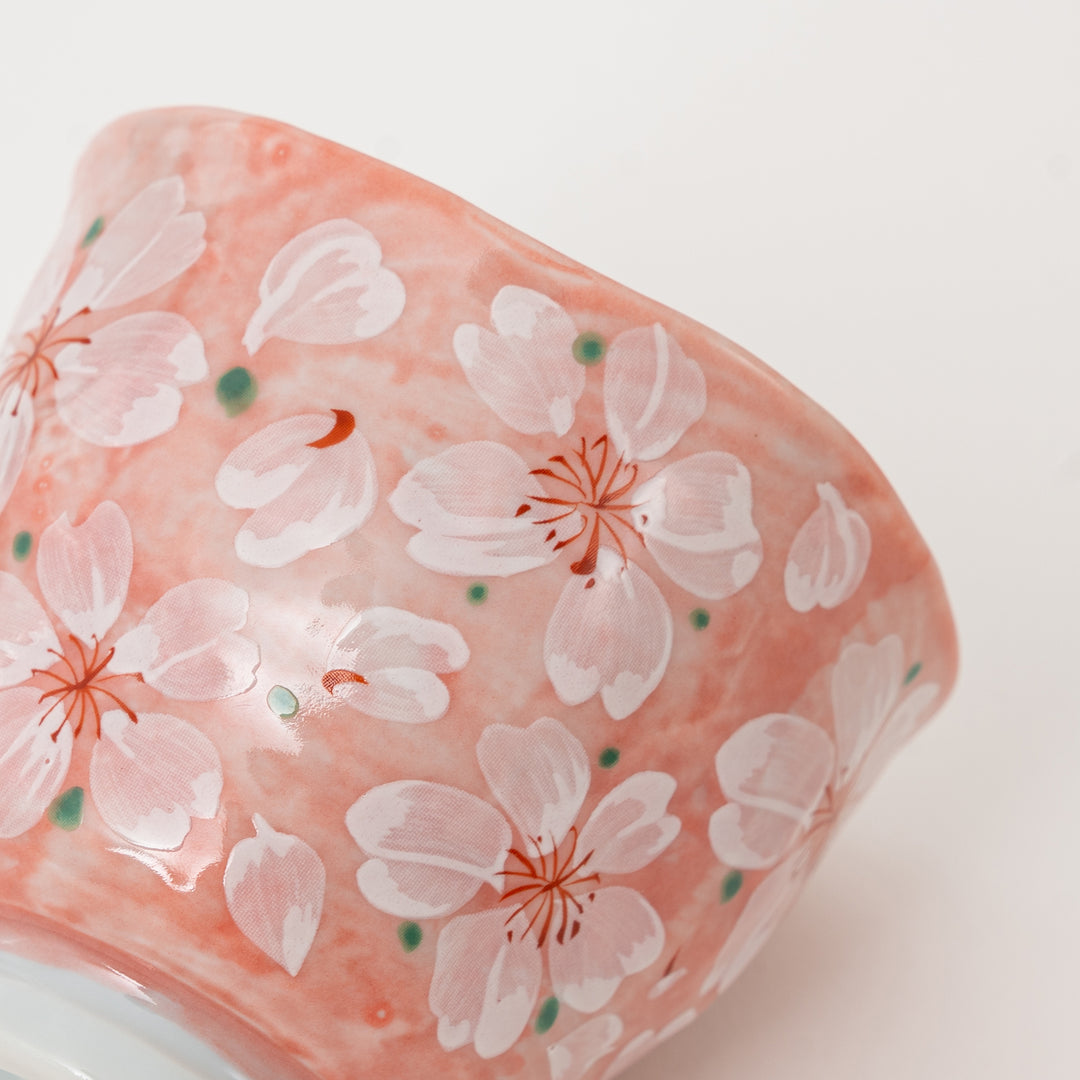Close-up of hand-painted cherry blossom pattern on Mino Ware tea cup