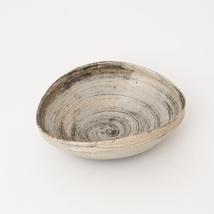 Japanese ceramic bowl with an organic oval shape and rustic Shigaraki glaze