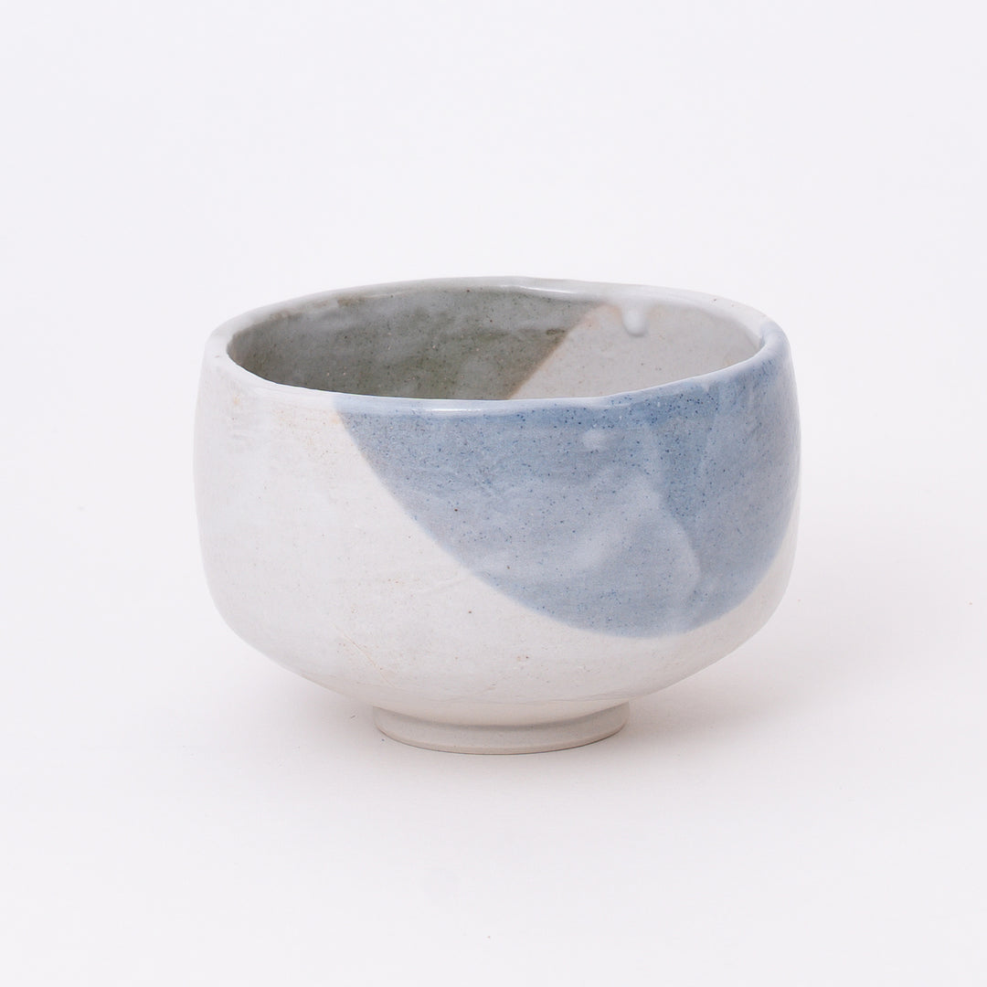 Front view of a handcrafted Mino Ware Mist Blue matcha bowl with soft blue-gray glaze