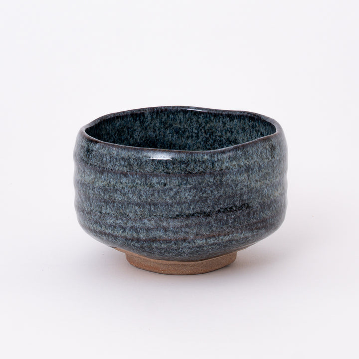 Front view of a Japanese Mino Ware Blue Ash Matcha Bowl featuring a deep blue and charcoal ash glaze.