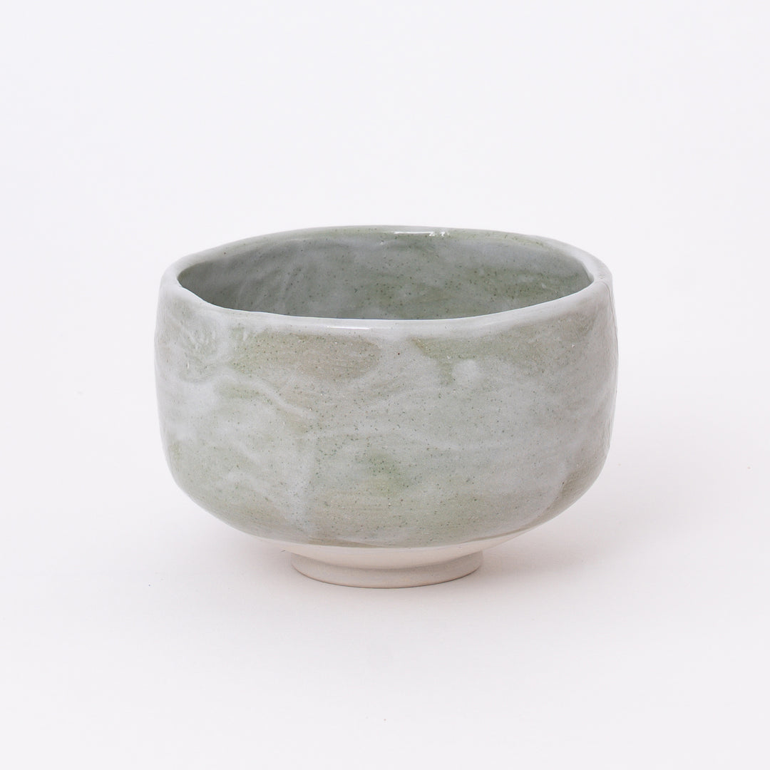 Handcrafted Japanese Mino Ware Green Shino Matcha Bowl with a soft sage green glaze, made in Japan.