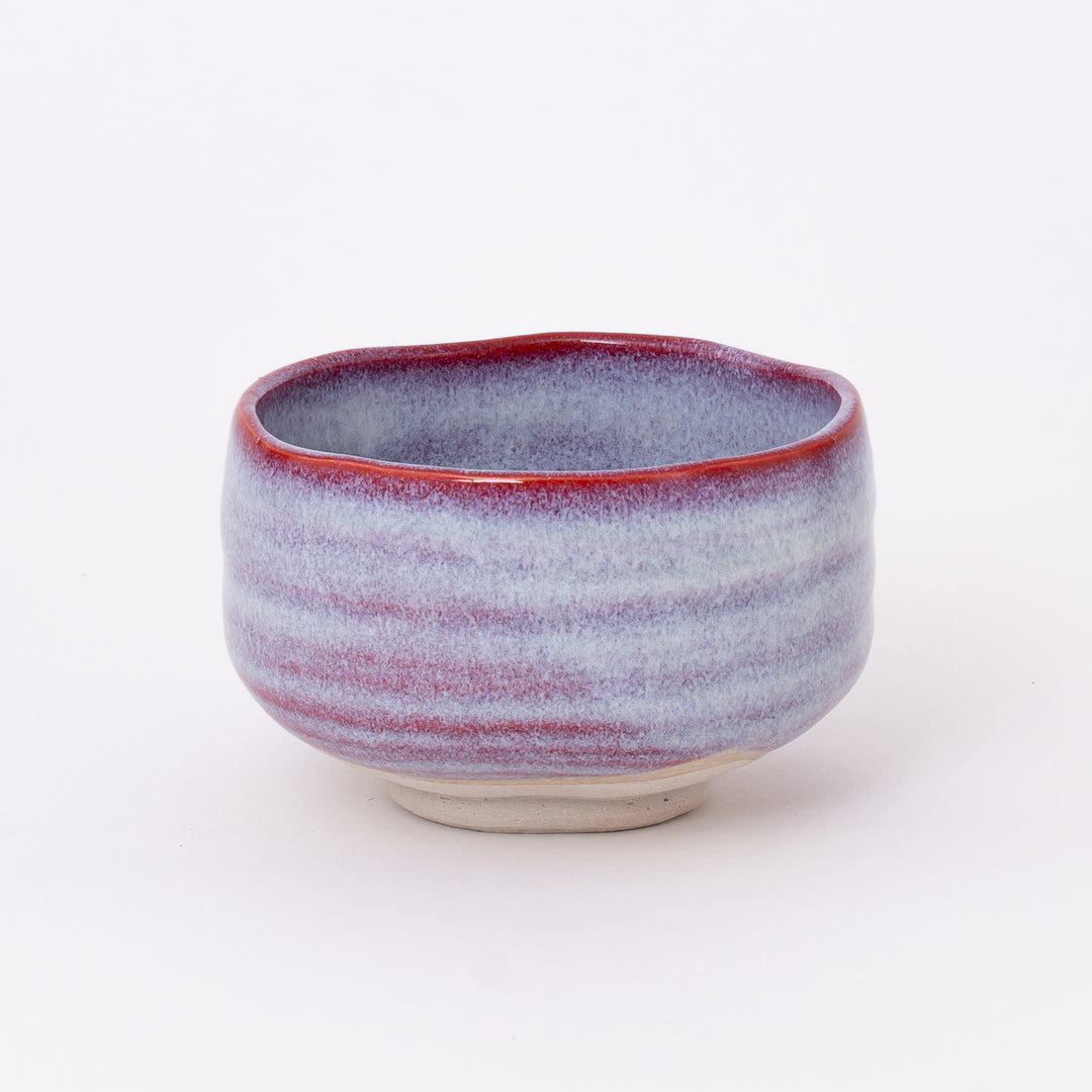 Handcrafted Japanese Mino Ware Sakura Unofu Matcha Bowl with a soft pink and white glaze, made in Japan.