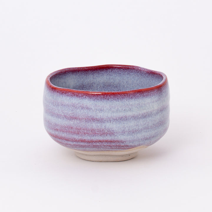 Handcrafted Japanese Mino Ware Sakura Unofu Matcha Bowl with a soft pink and white glaze, made in Japan.