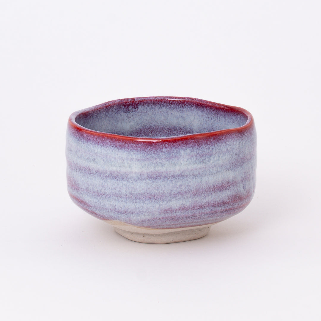 Side view of a handmade Mino Ware Sakura Unofu Matcha Bowl showcasing its rounded shape and layered glaze.