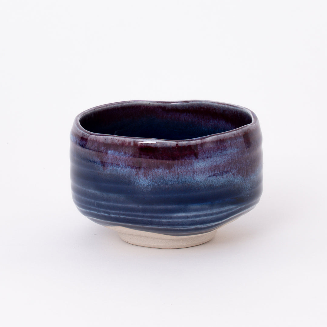 Handcrafted Japanese Mino Ware Purple Blue Matcha Bowl with a flowing violet and indigo glaze, made in Japan.