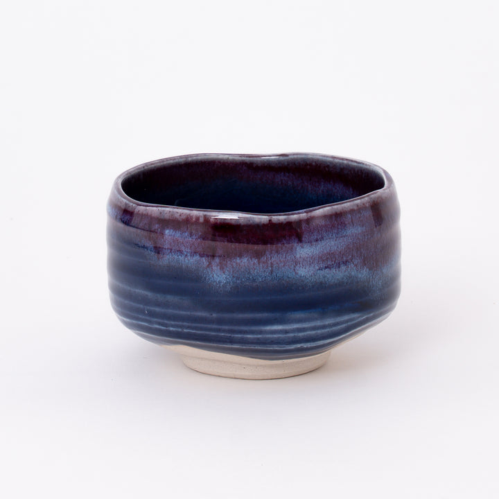 Handcrafted Japanese Mino Ware Purple Blue Matcha Bowl with a flowing violet and indigo glaze, made in Japan.