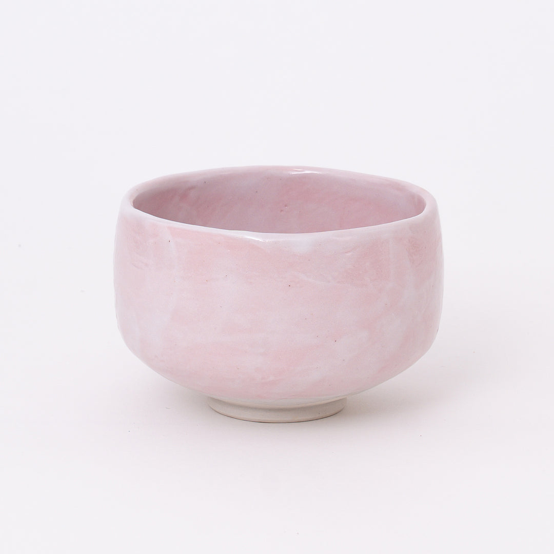 Front view of a Japanese Mino Ware Sakura Pink Shino Matcha Bowl featuring a soft blush pink glaze.