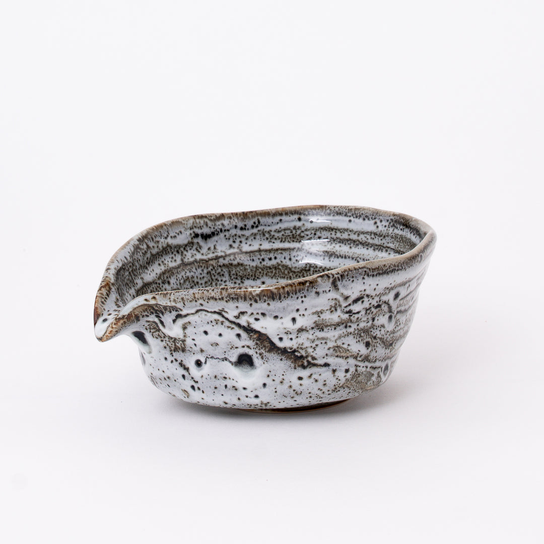 Handcrafted Japanese Mino Ware Flowing Glaze Katakuchi Matcha Bowl with a flowing white glaze and traditional pouring spout, made in Japan.