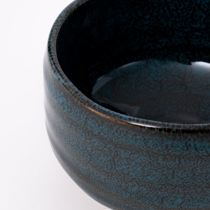 Close-up of the Ao Tenmoku glaze with blue-black crystalline textures and natural kiln-fired variations on a handcrafted Mino Ware matcha bowl.
