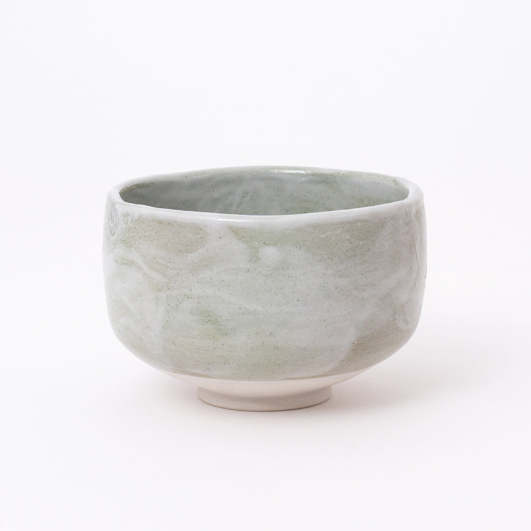 Front view of a Japanese Mino Ware Green Shino Matcha Bowl featuring a soft sage green and ivory glaze.